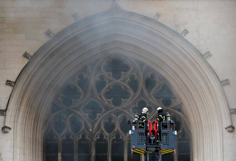 French firefighters battle a blaze at the Saint-Pierre-et-Saint-Paul cathedral. Reuters