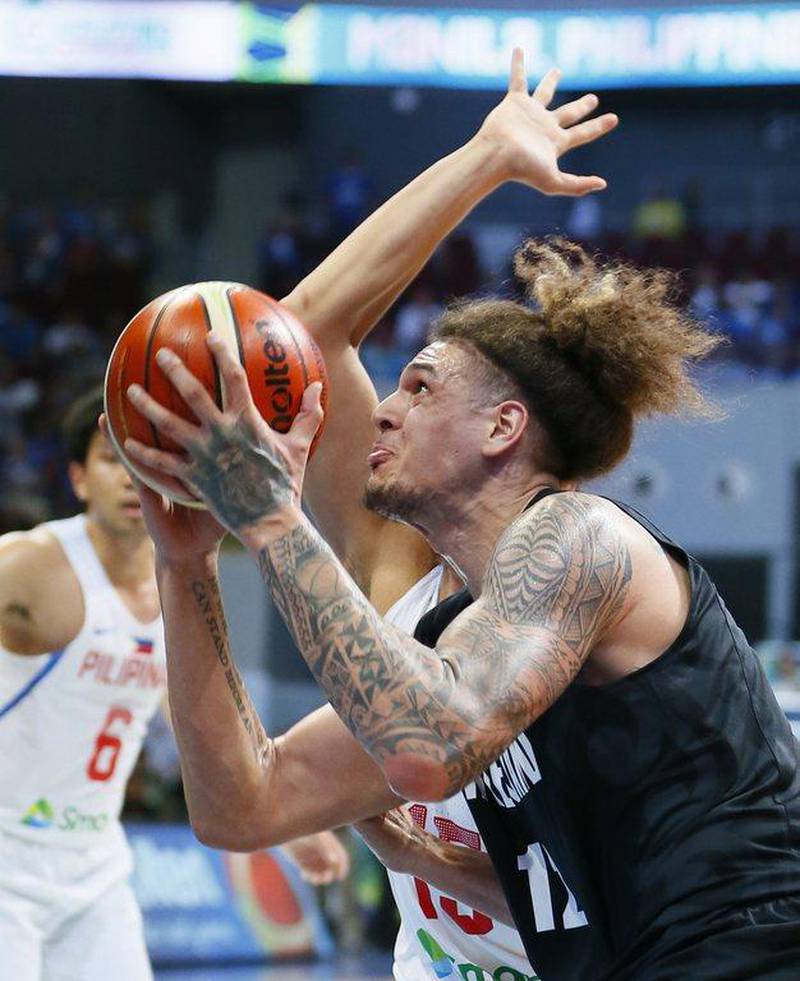New Zealand’s Isaac Fotu, front, goes to the basket as the Philippines’ Marc Pingris defends during the Group B Fiba Olympic Qualifying basketball match, Wednesday, July 6, 2016 at the Mall of Asia Arena in suburban Pasay city, south of Manila, Philippines. Bullit Marquez / AP Photo