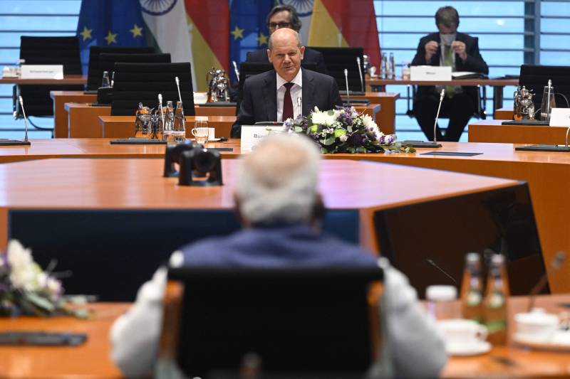 Mr Scholz sits opposite Mr Modi before the India-Germany governmental consultations at the Chancellery in Berlin. AFP