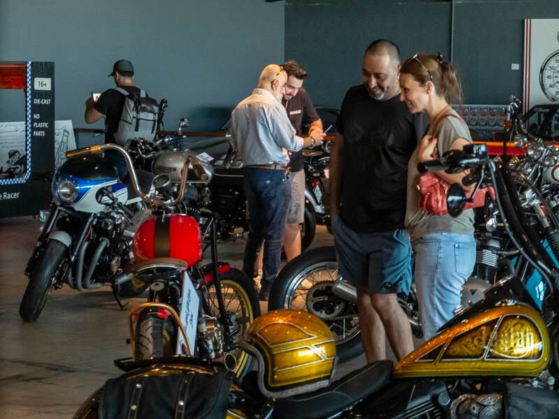 Visitors admire the custom motorbikes.
