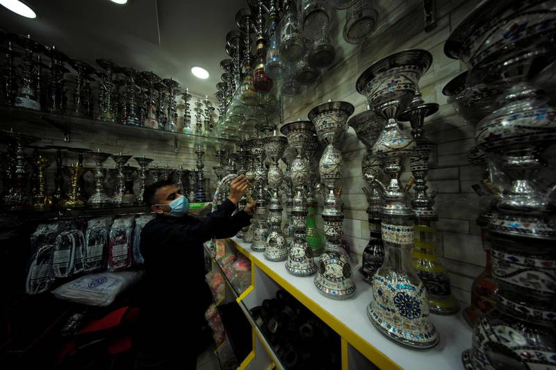 A salesman at his tobacco and shisha shop in Manama, Bahrain. Reuters