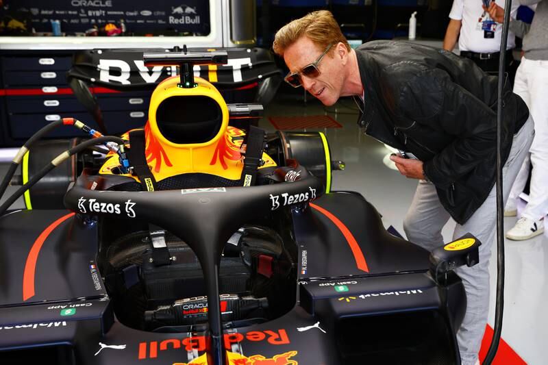 Actor Damien Lewis is given a tour of the Red Bull garage. Getty