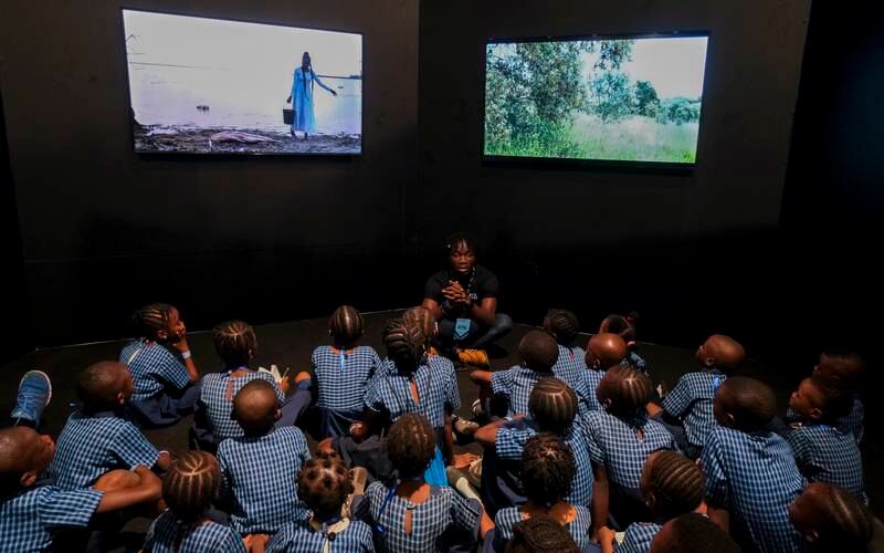 Schoolchildren visit Monica De Miranda's video installation at the 2022 Art X Lagos. Photo: Art X Lagos