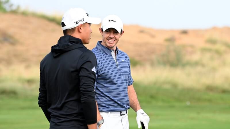 An image that illustrates this article McIlroy and Morikawa play practice rounds at Yas Links - in pictures