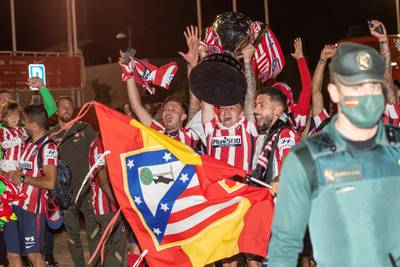 Atletico players celebrate with supporters at Wanda Sport City. EPA