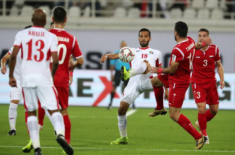 AL AIN , UNITED ARAB EMIRATES , January 10 ��� 2019 :- Mousa Mohammad Suleiman ( no 18 in white )  in action during the AFC Asian Cup UAE 2019 football match between Jordan vs Syria held at Sheikh Khalifa International Stadium in Al Ain. ( Pawan Singh / The National ) For News/Sports/Instagram. Story by Amith