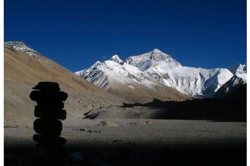 A cairn sits against the backdrop of the north face of Mt Everest. Photographs by Scott Macmillan for The National