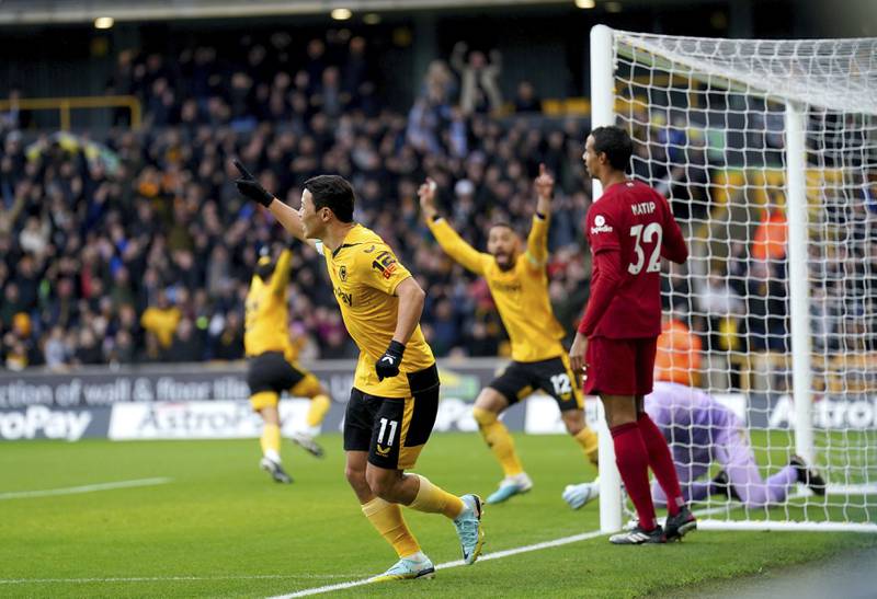 Wolves' Hwang Hee-chan celebrates after Liverpool's Joel Matip scores an own goal. PA