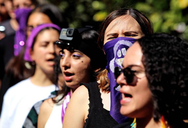 Students perform 'El violador eres tú' (The rapist, is you) -a song by Chilean Lastesis which became viral worldwide following their country's social protests- during a demonstration against gender violence and patriarchy at the Jesuit University of Guadalajara (ITESO), as part of the start of activities for 8M "International Women's Day" in Guadalajara, Mexico, on March 5, 2020. / AFP / Ulises Ruiz
