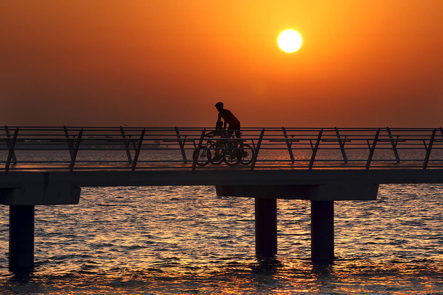 The park offers a cinematic biking experience against a sunset backdrop. Photo: Hudayriyat Island