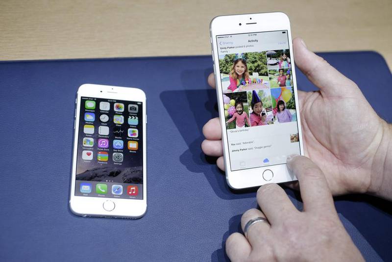 Apple last week unveiled the iPhone 6, left, and its bigger-screen twin the iPhone 6 Plus, sparking a frenzy among excited fans in the UAE. Marcio Jose Sanchez / AP Photo