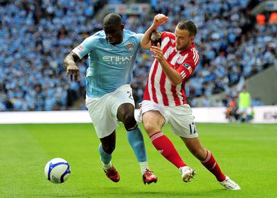 LONDON, ENGLAND - MAY 14: Micah Richards (L) of Manchester City holds off Marc Wilson (R) of Stoke City during the FA Cup sponsored by E.ON Final match between Manchester City and Stoke City at Wembley Stadium on May 14, 2011 in London, England. (Photo by Shaun Botterill/Getty Images)
