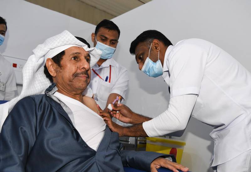 A Kuwaiti receives the first dose of Pfizer-BioTech Covid-19 vaccine injection in Kuwait City. EPA