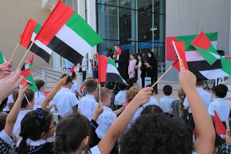 Brighton College Dubai pupils at a Flag Day ceremony.