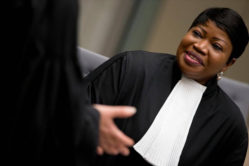 -FILE- In this Wednesday, April 4, 2018 image, chief prosecutor Fatou Bensouda waits for alleged jihadist leader Al Hassan Ag Abdoul Aziz Ag Mohamed Ag Mahmoud to enter the court room at the International Criminal Court in The Hague, Netherlands. Bensouda says she is launching a preliminary investigation to establish if there is enough evidence to merit a full-blown investigation into deportations of hundreds of thousands of Rohingya Muslims from Myanmar into Bangladesh. (AP Photo/Peter Dejong, Pool)