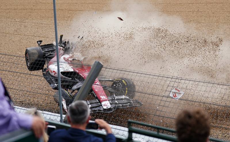 Alfa Romeo's Zhou Guanyu crashes into the barrier. PA