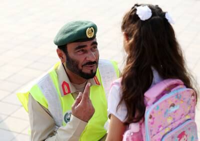Maj Gen Abdullah Al Ghaithi, director of the General Department of Organisation Protective Security and Emergency, greet children