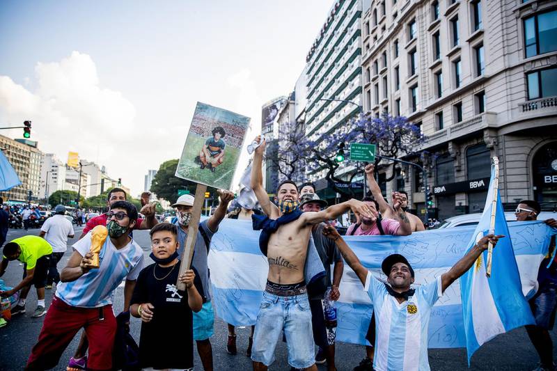 Fans pay tribute to Maradona after the news of his death was announced in Buenos Aires. Getty