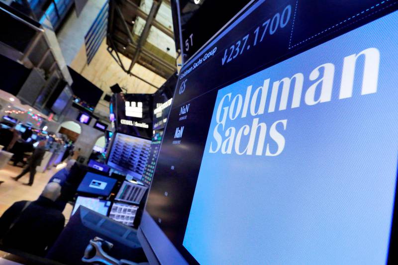 FILE - In this Dec. 13, 2016, file photo, the logo for Goldman Sachs appears above a trading post on the floor of the New York Stock Exchange. The Goldman Sachs Group Inc. reports financial results Wednesday, April 15, 2020.  (AP Photo/Richard Drew, File)
