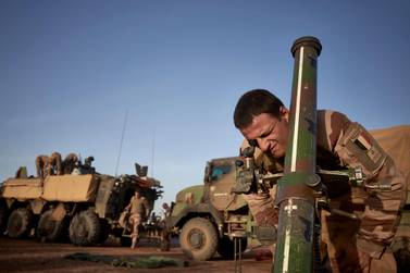 A soldier of the French Army adjusts the coordinates of a mortar ready to be used in Northern Burkina Faso last November. AFP