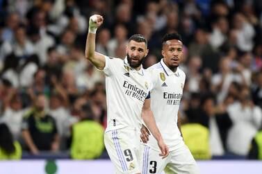 MADRID, SPAIN - MARCH 15: Karim Benzema of Real Madrid celebrates after scoring the team's first goal with teammate Eder Militao during the UEFA Champions League round of 16 leg two match between Real Madrid and Liverpool FC at Estadio Santiago Bernabeu on March 15, 2023 in Madrid, Spain. (Photo by Denis Doyle / Getty Images)
