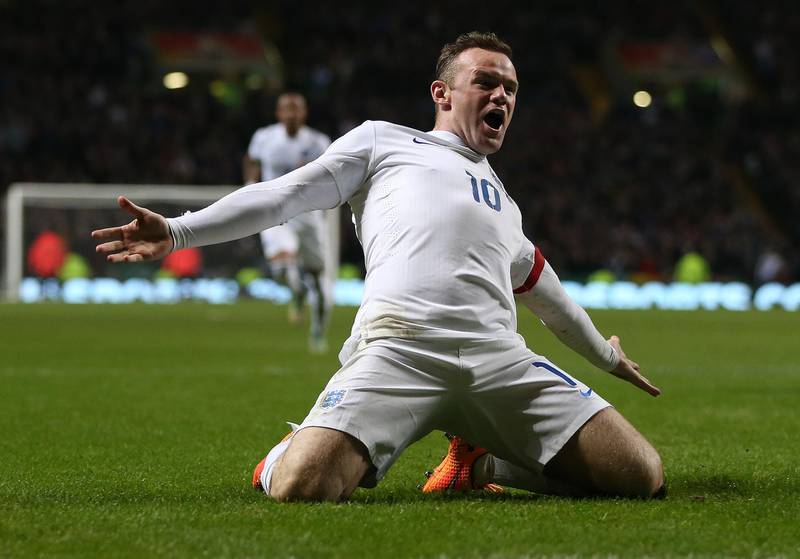 England striker Wayne Rooney celebrates scoring his team's second goal during the international friendly match between Scotland and England at Celtic Park in Glasgow on November 18, 2014. AFP