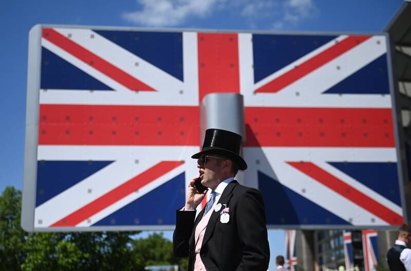 A racegoer in a morning suit and top hat on day one of Royal Ascot. EPA