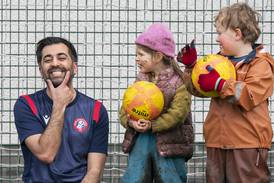 Humza Yousaf on the campaign trail in Edinburgh. He has pledged free football club membership for children if he becomes Scotland's First Minister. PA