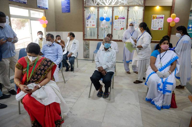 Medical workers wait to be inoculated with a Covid-19 vaccine at the King Koti hospital in Hyderabad. AFP