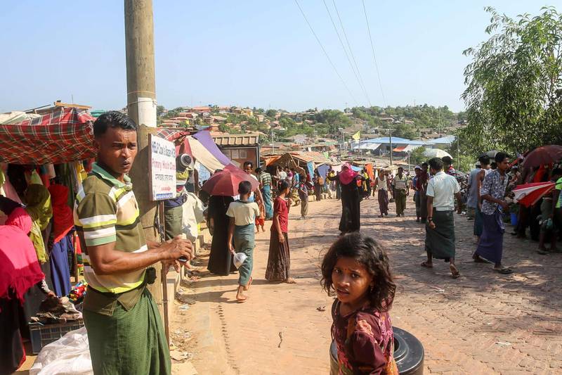 Rohingya refugees gather at a market as first cases of COVID-19 coronavirus have emerged in the area, in Kutupalong refugee camp in Ukhia on May 15, 2020. Emergency teams raced on May 15 to prevent a coronavirus "nightmare" in the world's largest refugee settlement after the first confirmed cases in a sprawling city of shacks housing nearly a million Rohingya.
 / AFP / Suzauddin RUBEL
