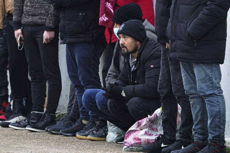 A group of people, thought to be migrants, at Dungeness lifeboat station, Kent. AP Photo