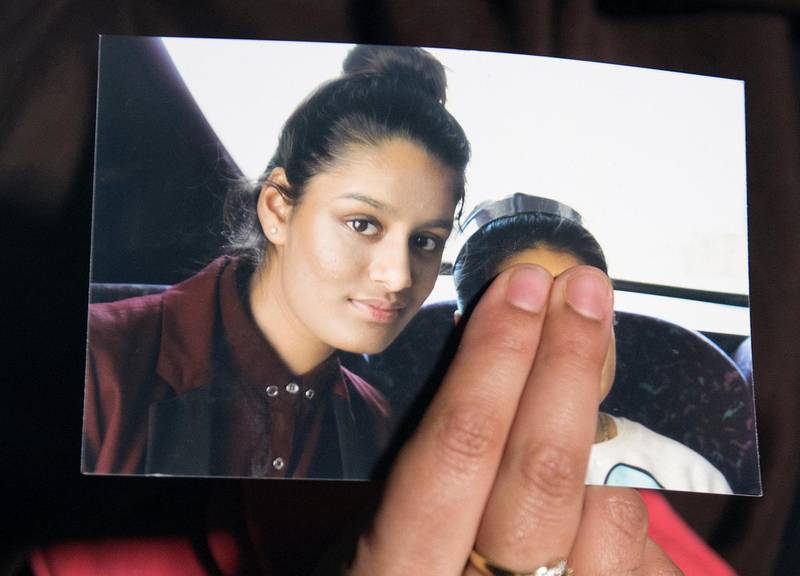 FILE PHOTO: Renu Begum, sister of teenage British girl Shamima Begum, holds a photo of her sister as she makes an appeal for her to return home at Scotland Yard, in London, Britain February 22, 2015. REUTERS/Laura Lean/Pool/File Photo