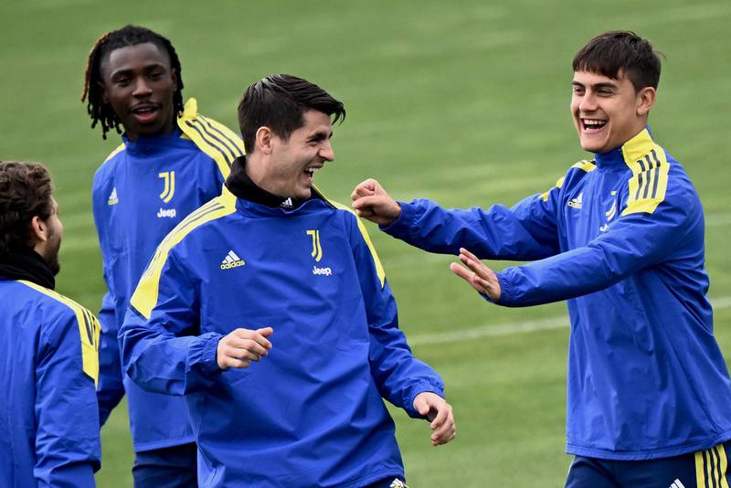 Juventus forwards Alvaro Morata, second left, and Paulo Dybala share a joke during a training session on Tuesday, March 15, 2022, for their Champions League last-16 second leg against Villarreal. AFP