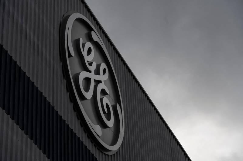 (FILES) In this file photot he General Electric logo is pictured, in Belfort, eastern France, on September 24, 2020.  General Electric announced a deal on March 10, 2021 to sell its aircraft leasing business to AerCap for $30 billion, establishing a new industry giant amid the pandemic-induced downturn in air travel. Under the transaction, the GE unit will be integrated into the Irish company. GE will have a 46-percent stake in the new entity and will nominate two members to AerCap's board, the announcement said.
 / AFP / SEBASTIEN BOZON
