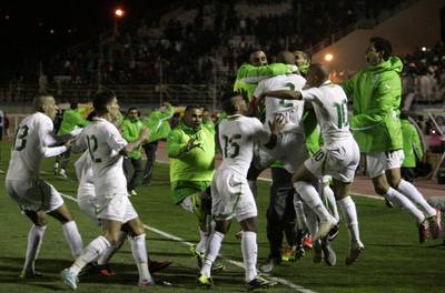 Algeria celebrate on Tuesday night after they sealed World Cup qualification. Anis Belghoul / AP