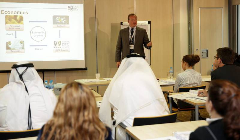 Emirati and expat legal trainees listen to a lecture at Dubai International Financial Centre Courts’ academy. DIFC and Abu Dhabi Global Markets allow lawyers of all nationalities to practice, while the domestic courts restrict formal hearings to UAE nationals
