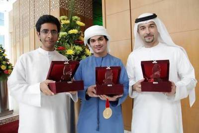 Winners of the Emirates Skills 2013 competition, Programming Category: Omar Muhairi, Abdalla Marzouqui and Professor Fadi Aloul, all from American University of Sharjah. Micaela Colace / The National