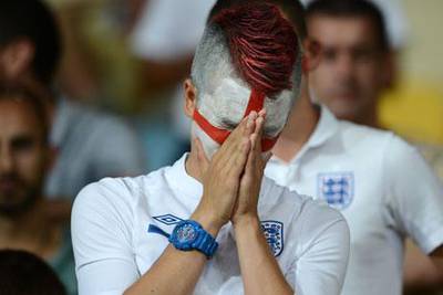 A fan shows his dejection after England lose on penalties to Italy at Euro 2012.