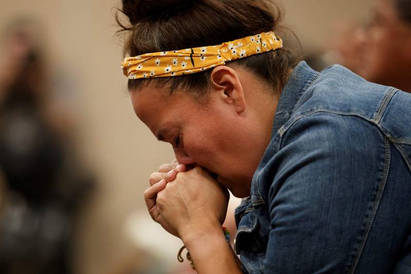 Carlea Stonestand, a relative of stabbing victim Bonnie Burns, fights back tears during the news conference in Saskatoon. AFP