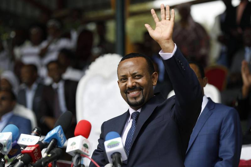(FILES) In this file photo taken on April 11, 2018 New Ethiopian Prime Minister Abiy Ahmed waves during his rally in Ambo, about 120km west of Addis Ababa, Ethiopia. Ethiopian Prime Minister Abiy Ahmed was awarded the Nobel Peace Prize for his efforts to resolve his country's conflict with bitter foe Eritrea, the Nobel Committee announced in Oslo on October 11, 2019
 / AFP / Zacharias Abubeker
