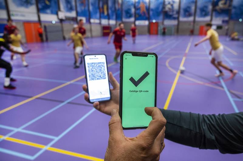 A QR code is displayed in a sports hall in Heerhugowaard, Netherlands. Owing to tightened coronavirus measures, indoor sports associations are obliged to check the smartphones of players and visitors. EPA