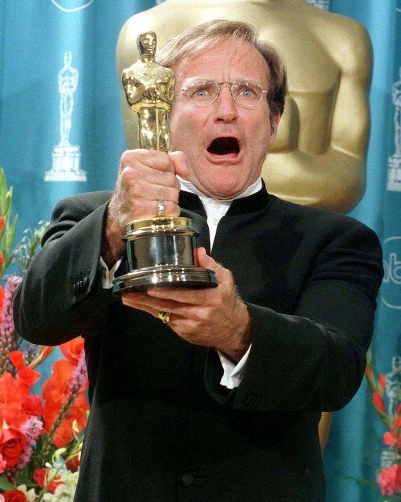 Robin Williams holds his Oscar after winning Best Performance by an Actor in a Supporting Role for his role in Good Will Hunting at the 70th Annual Academy Awards in this file picture taken March 23, 1998. Reuters