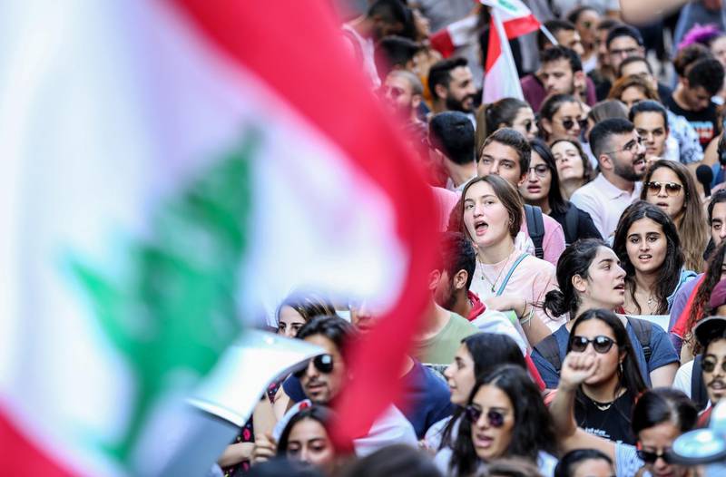 Lebanese students from various universities shout slogans during ongoing anti-government protests as they march from Lebanese University toward Riad Solh square in front the government palace in Beirut.  EPA