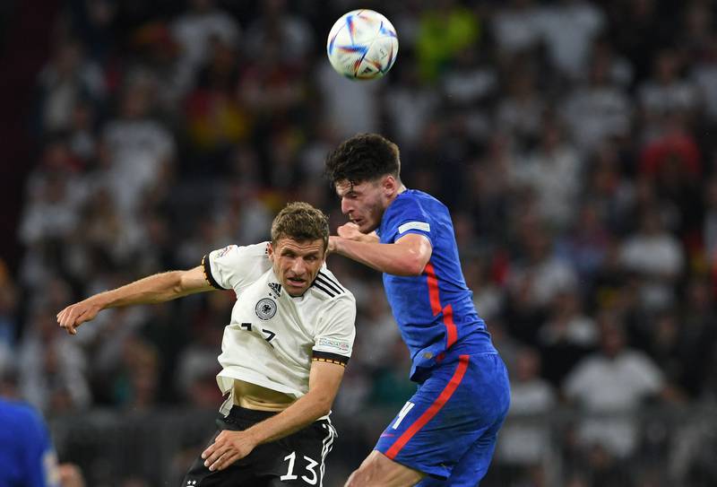 Germany forward Thomas Muller and England's Declan Rice battle for the ball.  AFP