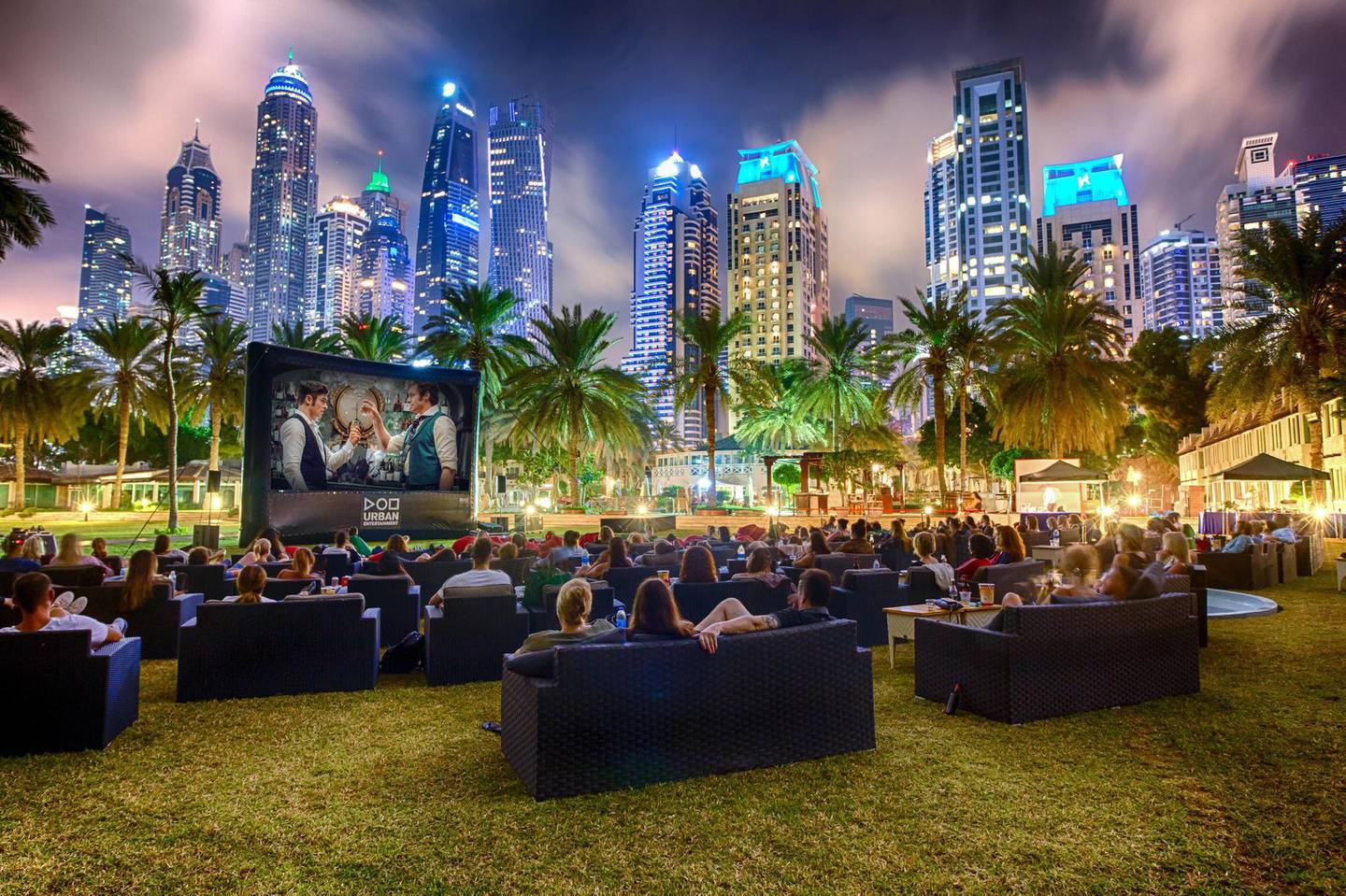 Urban Outdoor Cinema at Habtoor Grand, framed by the skyline of Dubai Marina. Courtesy Urban Outdoor Entertainment.