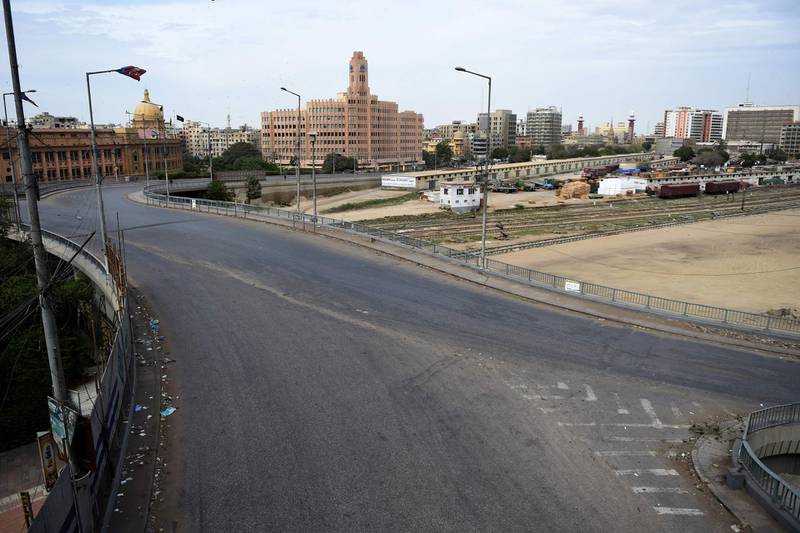 General view of a deserted road in a business district during a lockdown after Sindh province government announced the closing of markets, public places and ban large gatherings amid concerns over the spread of the COVID-19 novel coronavirus, in Karachi on March 23, 2020.
  / AFP / Rizwan TABASSUM
