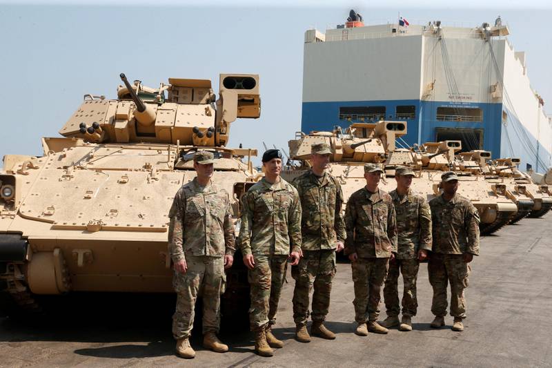 American soldiers stand near armoured fighting vehicles contributed by the U.S. government to the Lebanese army at Beirut's port, Lebanon, August 14, 2017. REUTERS/Mohamed Azakir