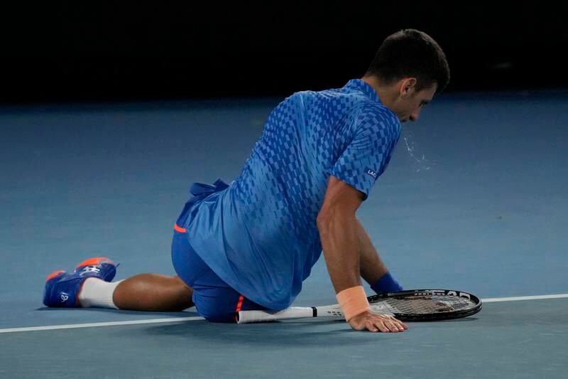 Novak Djokovic takes a tumble in their third round match. AP