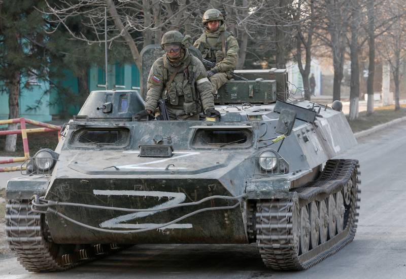 Russian troops patrol on an armoured vehicle painted with the letter Z in Dokuchaievsk, Ukraine. Reuters