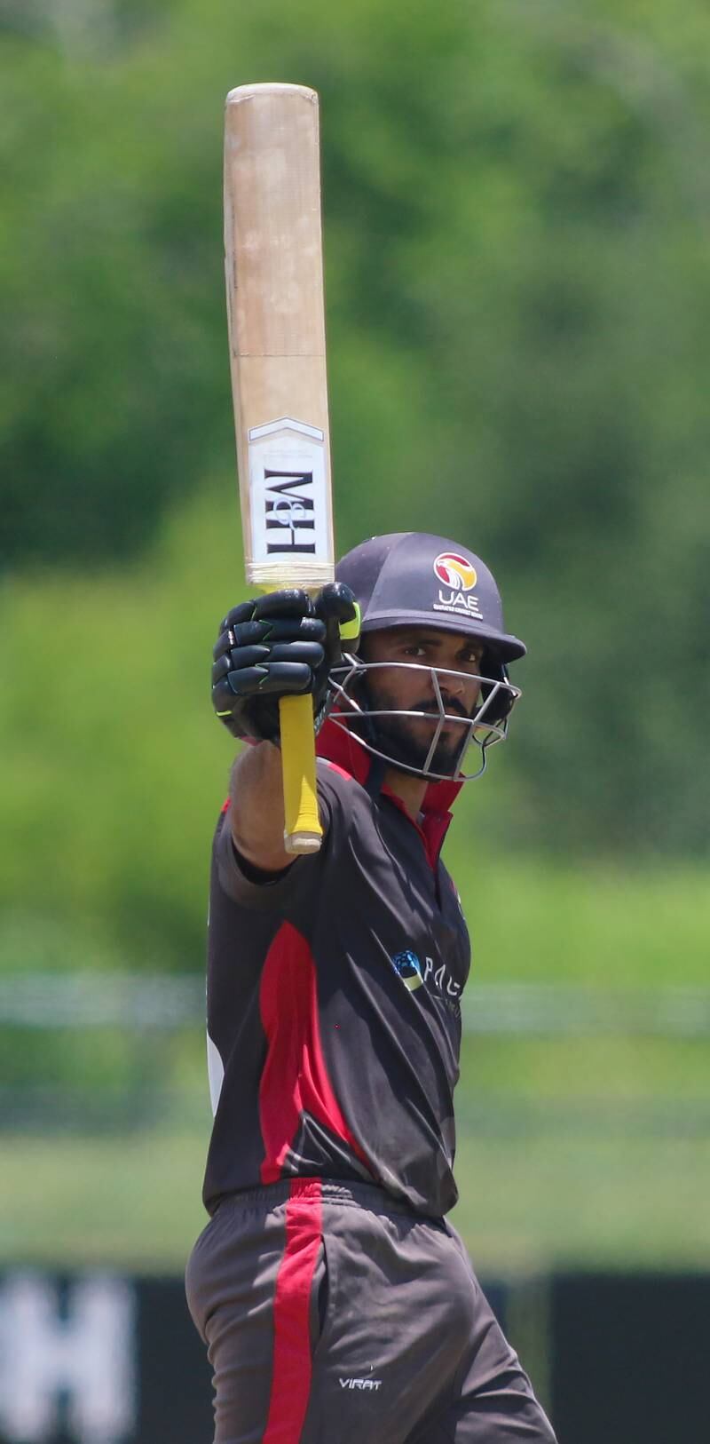 CP Rizwan raises his bat after reaching 50 for UAE against United States in Texas. 